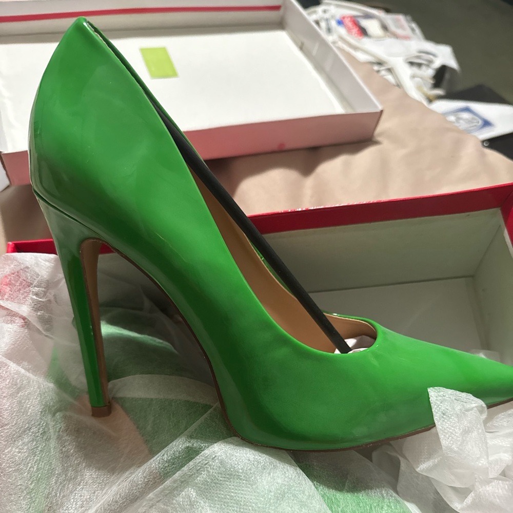 Green Stilettos sz10 worn once …original box..additional heel caps included
